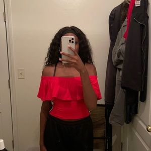 small pink off the shoulder shirt